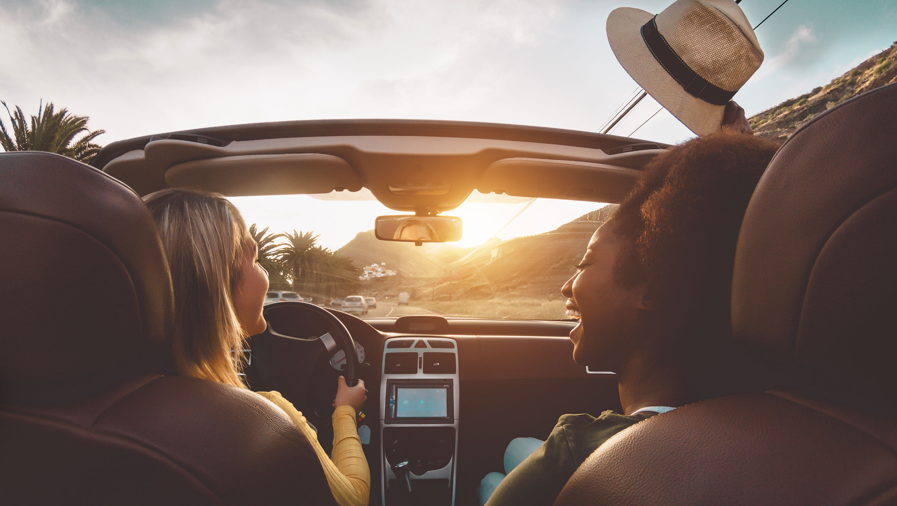 two women driving in convertible car